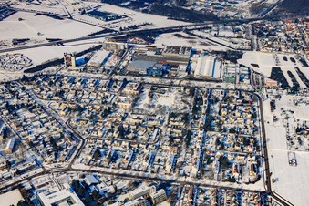 L'Oreal Produktion Deutschland GmbH and Hertzstraße from the south in winter with snow in the district Nordweststadt in Karlsruhe in the state Baden-Wuerttemberg, Germany