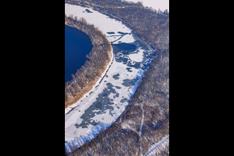 Aerial view of Frozen Althrein Kleiner Bodensee in winter with snow in the district Neureut in Karlsruhe in the state Baden-Wuerttemberg, Germany