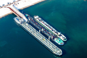 Aerial view of Wintry snowy Wharves and piers with ship loading terminals in the oil harbor in the district Knielingen in Karlsruhe in the state Baden-Wurttemberg, Germany
