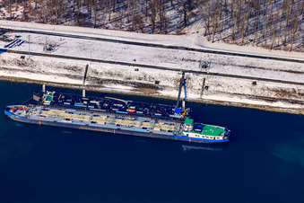 Oil port in winter with snow in the district Knielingen in Karlsruhe in the state Baden-Wuerttemberg, Germany