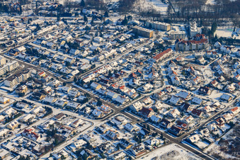 Mozartstraße in winter with snow in Jockgrim in the state Rhineland-Palatinate, Germany
