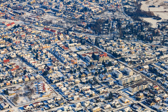 Marienstraße in winter with snow in Jockgrim in the state Rhineland-Palatinate, Germany