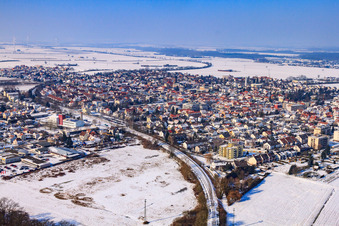 Aerial view of City view with railway line from the southeast in winter with snow in Kandel in the state Rhineland-Palatinate, Germany