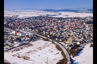 Aerial photograpy of City view with railway line from the southeast in winter with snow in Kandel in the state Rhineland-Palatinate, Germany