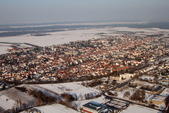 City view with railway line from the southwest in winter with snow in Kandel in the state Rhineland-Palatinate, Germany