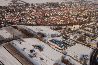 Aerial view of City view with railway line from the southwest in winter with snow in Kandel in the state Rhineland-Palatinate, Germany