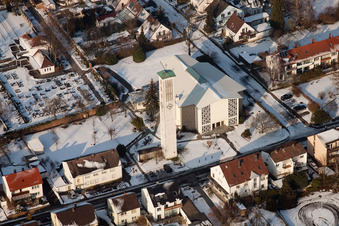 Aerial view of St. Pius Church in winter with snow in Kandel in the state Rhineland-Palatinate, Germany
