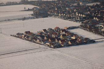 New development area Brotäcker in winter with snow in Steinweiler in the state Rhineland-Palatinate, Germany