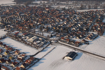 Aerial view of Brotäckerstraße in winter with snow in Steinweiler in the state Rhineland-Palatinate, Germany