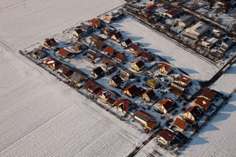 Aerial view of New development area Brotäcker in winter with snow in Steinweiler in the state Rhineland-Palatinate, Germany