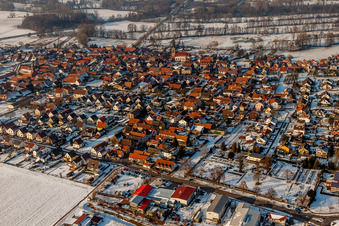 Winter snow-covered village view in Steinweiler in the state Rhineland-Palatinate, Germany