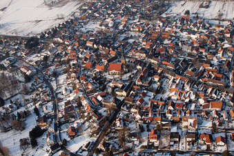 Oblique view of Wintry snowy Town View of the streets and houses of the residential areas in the district Ingenheim in Billigheim-Ingenheim in the state Rhineland-Palatinate