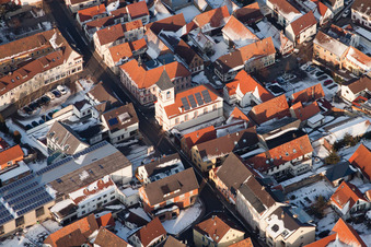 Aerial view of Church in the town center in winter with snow in the district Ingenheim in Billigheim-Ingenheim in the state Rhineland-Palatinate, Germany
