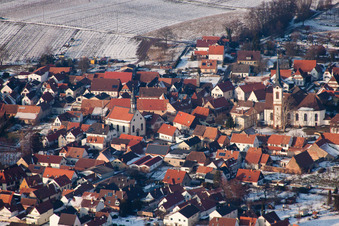 Oblique view of Winter snow-covered village view in Göcklingen in the state Rhineland-Palatinate, Germany