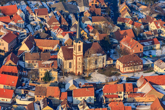 Church of St. Lawrence in the snow in Göcklingen in the state Rhineland-Palatinate, Germany
