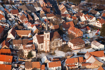 Winter snow-covered village view in Göcklingen in the state Rhineland-Palatinate, Germany from above