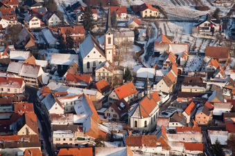 Winter snow-covered village view in Göcklingen in the state Rhineland-Palatinate, Germany out of the air