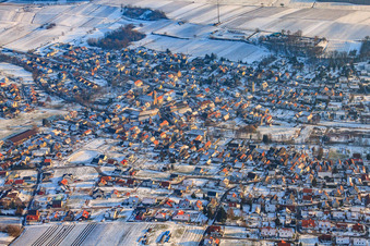Wine-growing village from the north in winter with snow in Klingenmünster in the state Rhineland-Palatinate, Germany
