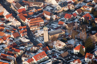 Protestant church in the town center in winter with snow in Klingenmünster in the state Rhineland-Palatinate, Germany