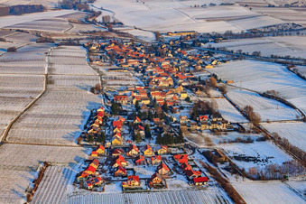 Wine-growing village from the west in winter with snow in Niederhorbach in the state Rhineland-Palatinate, Germany