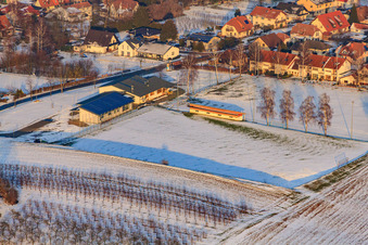 Aerial view of Dierbachhalle and sports fields in winter when there is snow in Dierbach in the state Rhineland-Palatinate, Germany