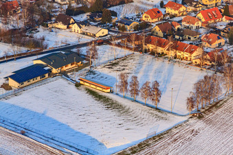 Aerial photograpy of Dierbachhalle and sports fields in winter when there is snow in Dierbach in the state Rhineland-Palatinate, Germany