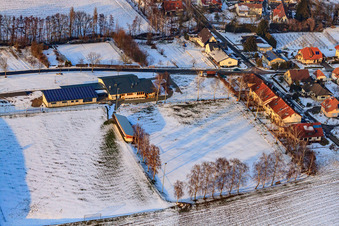 Dierbachhalle and sports fields in winter when there is snow in Dierbach in the state Rhineland-Palatinate, Germany from above