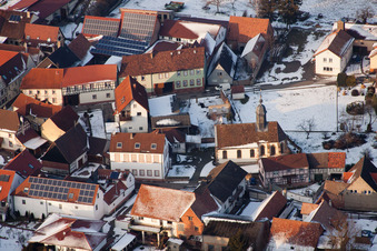 Aerial view of Wintry snowy Church building in the village of in Dierbach in the state Rhineland-Palatinate