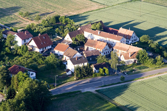 Oblique view of Village - view on the edge of agricultural fields and farmland in Minfeld in the state Rhineland-Palatinate