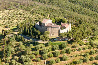 Aerial photograpy of Castle of the fortress Castello di Montegualandro on lake Trasemino in Montecchio in Umbria, Italy