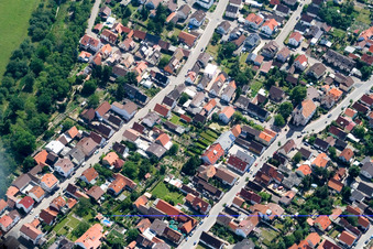 Leopoldstraße with church in the district Leopoldshafen in Eggenstein-Leopoldshafen in the state Baden-Wuerttemberg, Germany