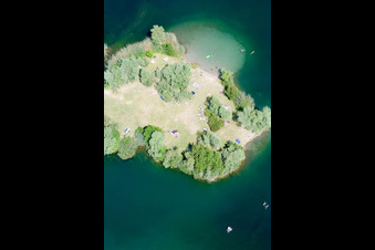 Bathers on the beach and the island of the lake Johanneswiese in Jockgrim in Jockgrim in the state Rhineland-Palatinate