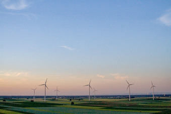 Wind turbine windmills on a field in Herxheimweyher in the state Rhineland-Palatinate