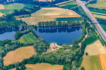 Quarry lake on the B9 in Rheinzabern in the state Rhineland-Palatinate, Germany