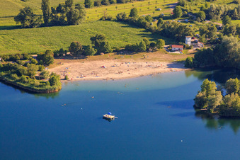 Beach resort Jockgrim with bathing island in the Johanneswiese quarry lake in Jockgrim in the state Rhineland-Palatinate, Germany