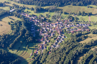 Aerial view of Village - view on the edge of agricultural fields and farmland in Niederschlettenbach in the state Rhineland-Palatinate, Germany