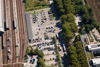 Track progress and building of the main station of the railway in Karlsruhe in the state Baden-Wurttemberg from the plane