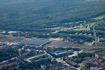 Track progress and building of the main station of the railway in Karlsruhe in the state Baden-Wurttemberg from the plane