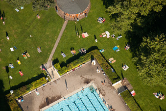 Bathers on the lawn by the pool of the swimming pool Rueppurr in Karlsruhe in the state Baden-Wurttemberg