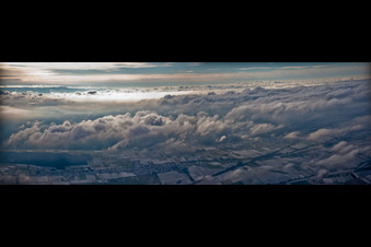 Weather conditions with cloud formation ueber dem winterlichen Bienwald in Freckenfeld in the state Rhineland-Palatinate