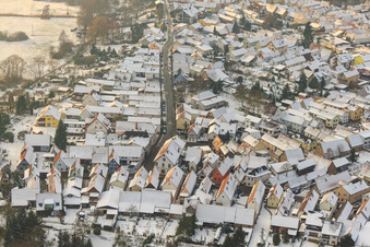 Bahnhofstraße in winter with snow in Jockgrim in the state Rhineland-Palatinate, Germany