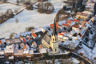 Aerial photograpy of St. Dionysius in Hinterstädel in winter with snow in Jockgrim in the state Rhineland-Palatinate, Germany