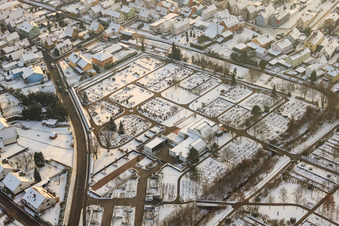 Cemetery in winter with snow in Wörth am Rhein in the state Rhineland-Palatinate, Germany
