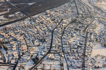 Aerial view of Bahnhofstraße in winter with snow in Wörth am Rhein in the state Rhineland-Palatinate, Germany