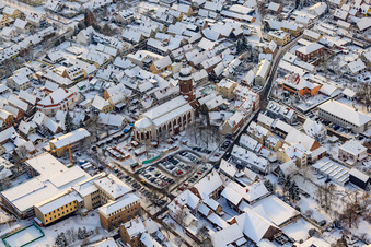 Christmas market at Plätzl and around St. George's Church in snow in Kandel in the state Rhineland-Palatinate, Germany from the plane