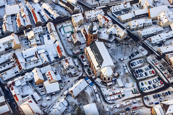 Drone image of Christmas market at Plätzl and around St. George's Church in snow in Kandel in the state Rhineland-Palatinate, Germany