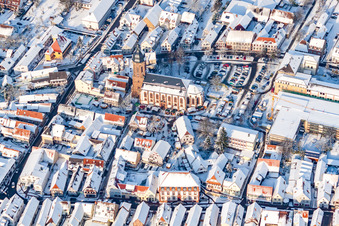 Christmas market at Plätzl and around St. George's Church in snow in Kandel in the state Rhineland-Palatinate, Germany out of the air