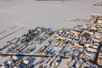 Oblique view of Main Street in Winter/Snow in the district Hayna in Herxheim bei Landau in the state Rhineland-Palatinate, Germany