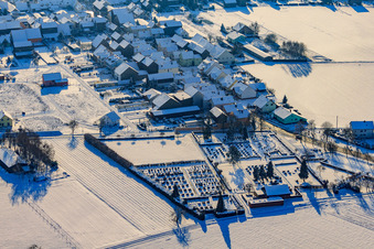 Cemetery in winter with snow in Hatzenbühl in the state Rhineland-Palatinate, Germany