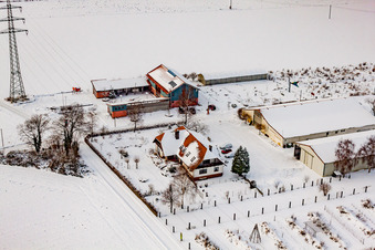 Aerial photograpy of Schoßberghof in winter with snow in Minfeld in the state Rhineland-Palatinate, Germany
